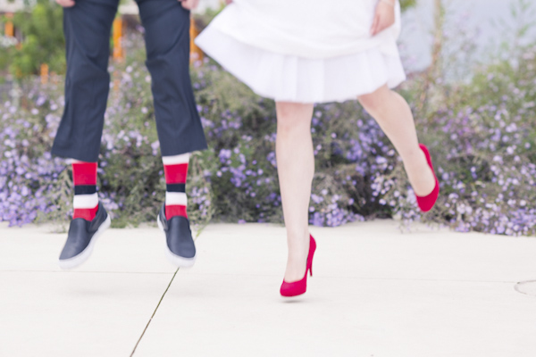 Bride and groom jump- wedding photo by top Canadian wedding photographer Rebecca Wood